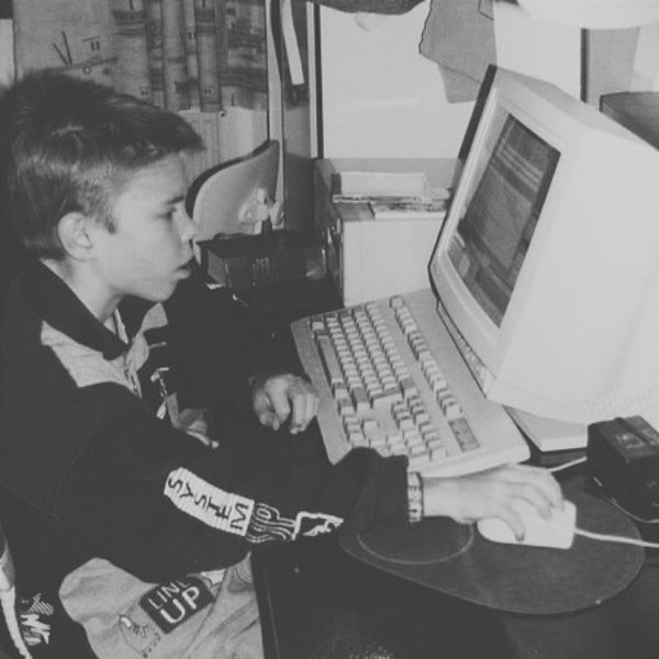 About a 10 year old boy on an old computer.
